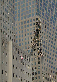 Beam from the World Trade Center lodged in a nearby building (photo
by Michael Rieger, FEMA News. As works of the U.S. federal government, all FEMA images are in the public domain.