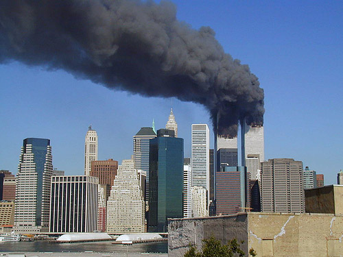 Plumes of smoke billow from the World Trade Center towers, September
11 (photo by Flickr user Michael Foran at http://www.flickr.com/photos/pixorama/ used under Creative Commons license Attribution 2.0 Generic