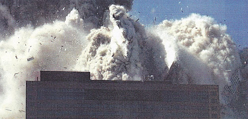 WTC7 engulfed in debris (photo from NIST Report Executive Summary
2008)