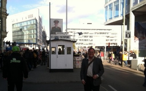 Standing at Checkpoint Charlie, the gateway through the Berlin Wall, 25 years after the Wall came down