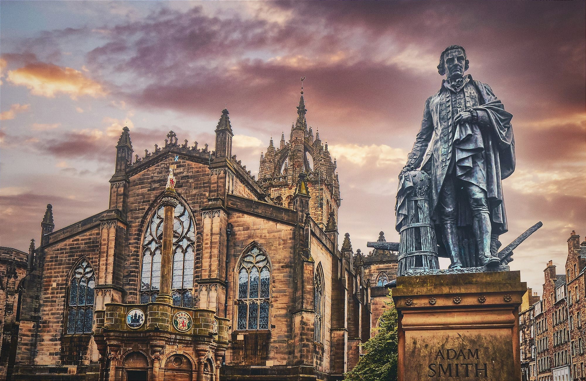 a statue of a man standing in front of a building