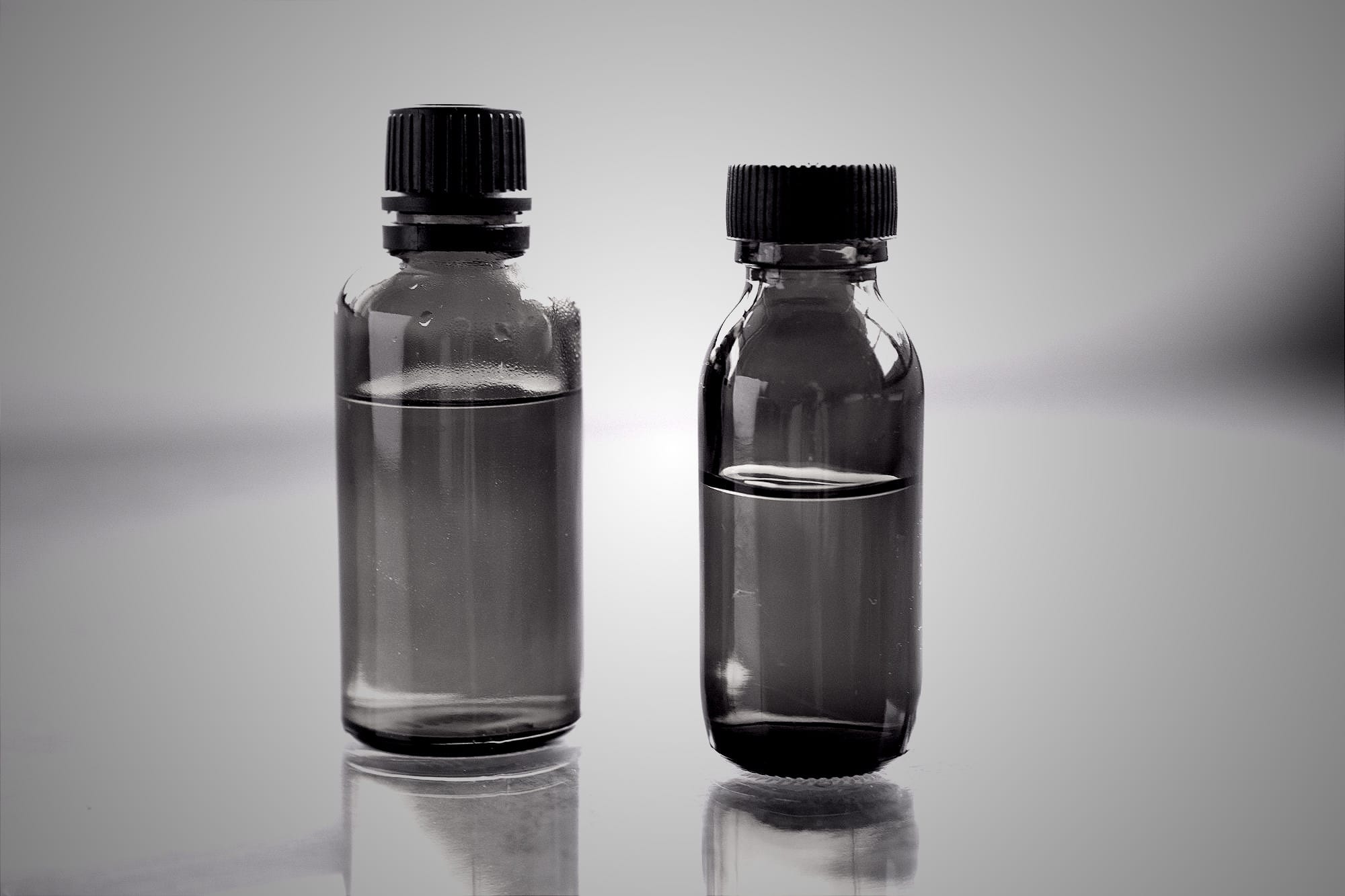 a couple of brown bottles sitting on top of a table