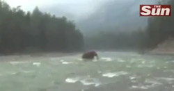 alleged woolly mammoth crossing a river