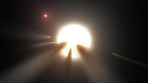 An artist’s concept depicts an orbiting swarm of dusty comet fragments as a possible explanation for the unusual light signal of KIC 8462852. (by NASA/JPL-Caltech [Public domain], via Wikimedia Commons)