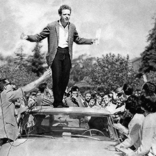 UC Berkeley, Sproul Hall Plaza, October 1 1964. Free Speech Movement advocates, including Mario Savio in this instance, speak from the roof of a police car.